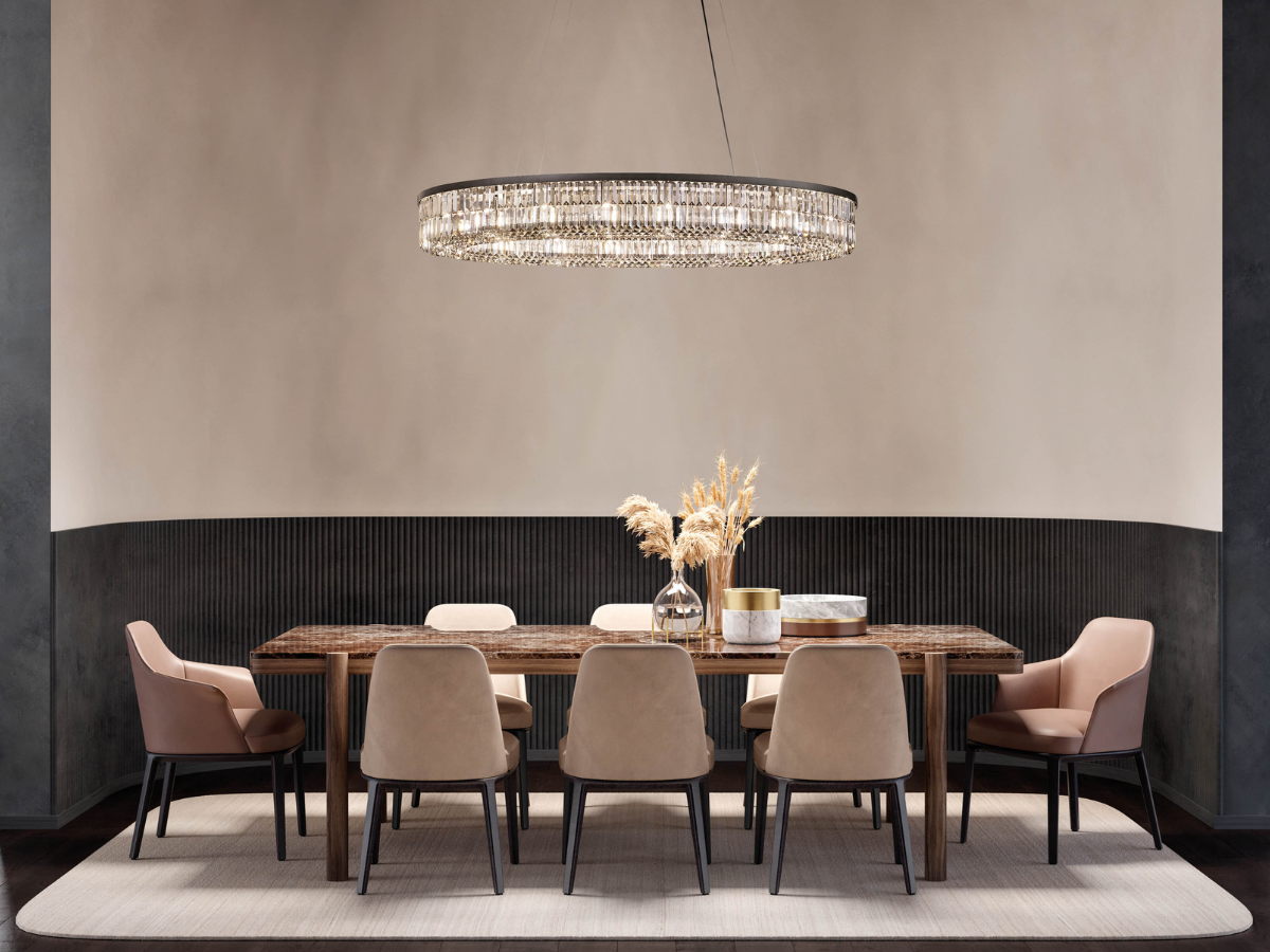 Crystal pendant light above an elegantly laid dining table