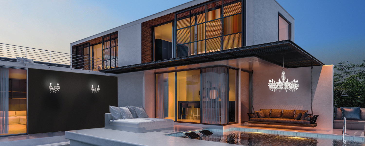 Villa in the evening with an illuminated pool, a chandelier and a hanging sofa, wall lights on a dark facade